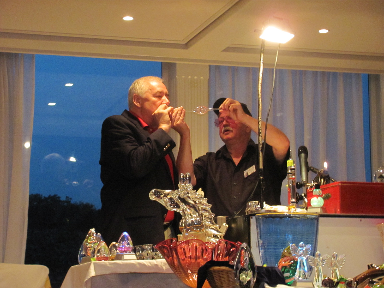 Blowing a Glass ornament during glass blowing demo